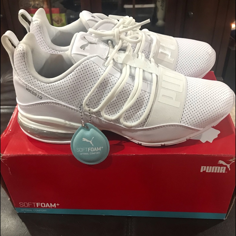 Brand new men’s sneakers. White leather size 9.